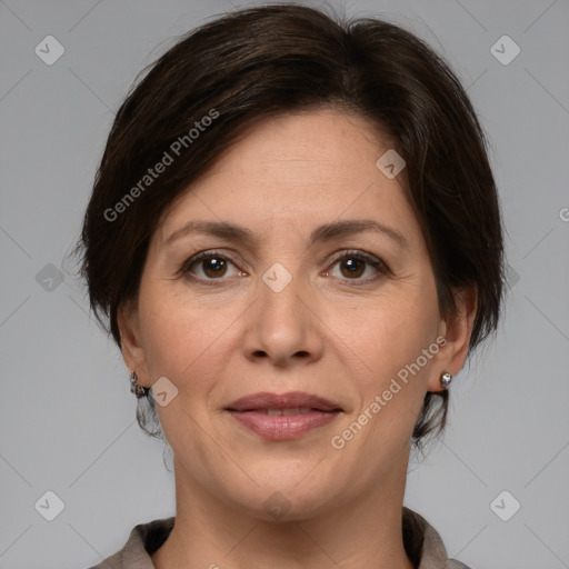 Joyful white adult female with medium  brown hair and brown eyes