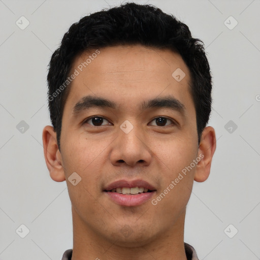 Joyful latino young-adult male with short  brown hair and brown eyes