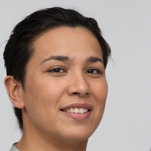 Joyful white young-adult female with short  brown hair and brown eyes