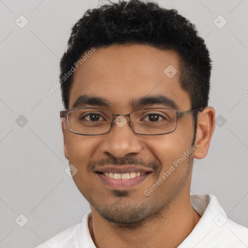 Joyful latino young-adult male with short  black hair and brown eyes