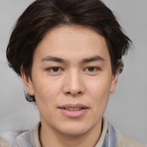Joyful white young-adult male with medium  brown hair and brown eyes