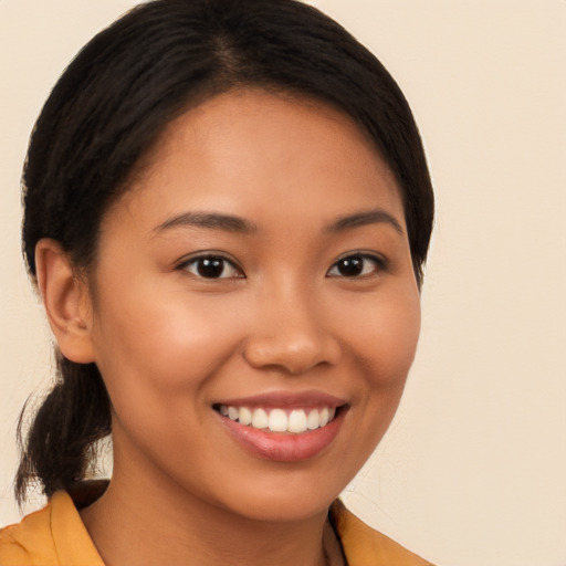 Joyful latino young-adult female with medium  black hair and brown eyes