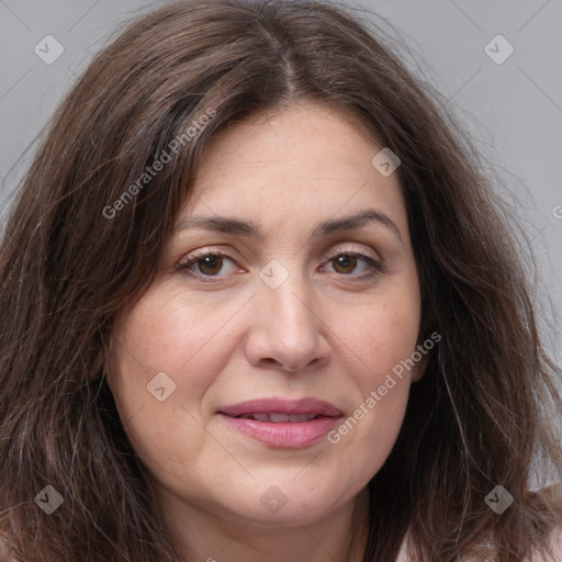 Joyful white adult female with long  brown hair and brown eyes