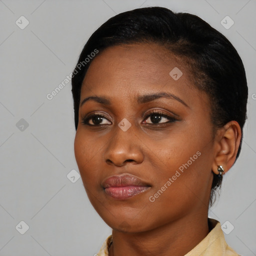 Joyful black young-adult female with medium  black hair and brown eyes