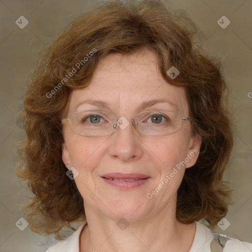 Joyful white adult female with medium  brown hair and blue eyes