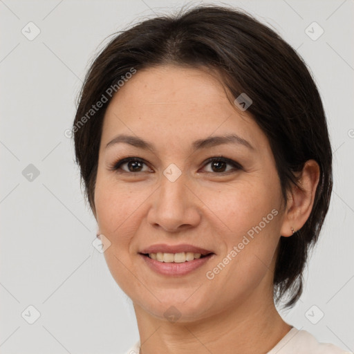 Joyful white adult female with medium  brown hair and brown eyes