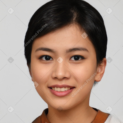 Joyful asian young-adult female with short  black hair and brown eyes