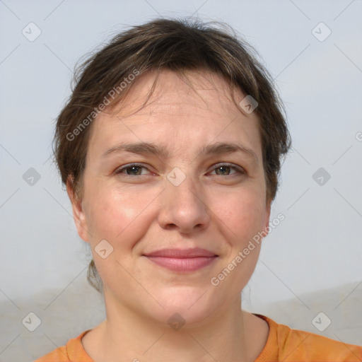 Joyful white adult female with short  brown hair and brown eyes