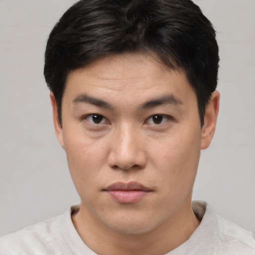 Neutral asian young-adult male with short  brown hair and brown eyes