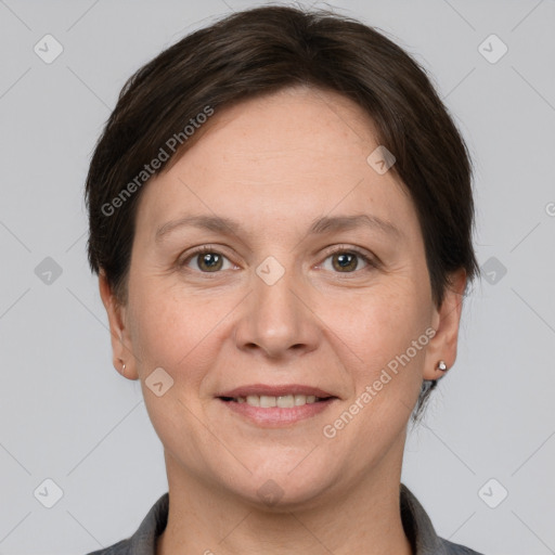 Joyful white adult female with short  brown hair and brown eyes