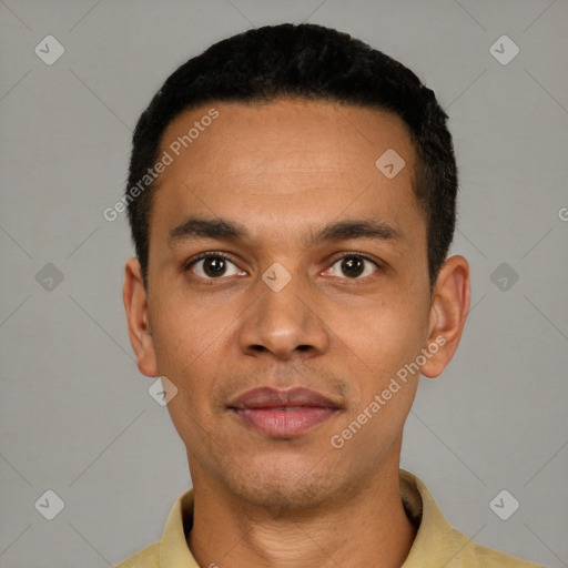 Joyful latino young-adult male with short  black hair and brown eyes