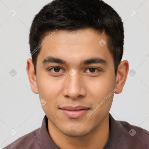 Joyful latino young-adult male with short  brown hair and brown eyes