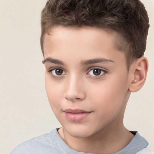 Joyful white child male with short  brown hair and brown eyes