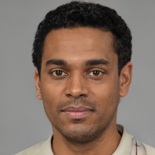 Neutral black young-adult male with short  black hair and brown eyes