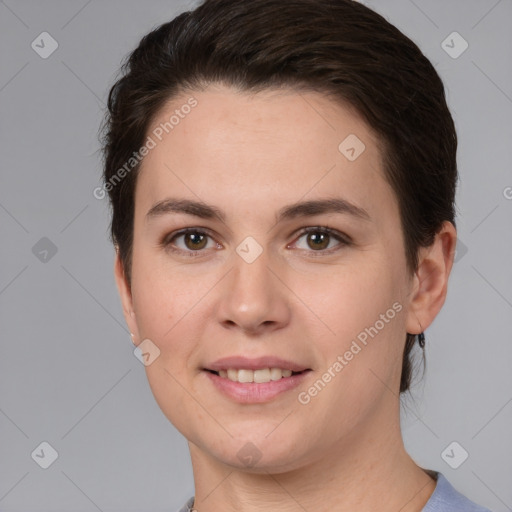 Joyful white young-adult female with short  brown hair and brown eyes