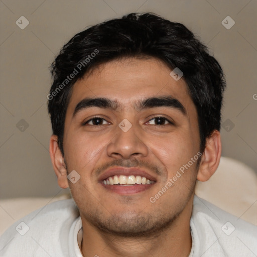 Joyful latino young-adult male with short  black hair and brown eyes