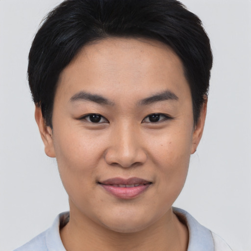 Joyful asian young-adult female with short  brown hair and brown eyes