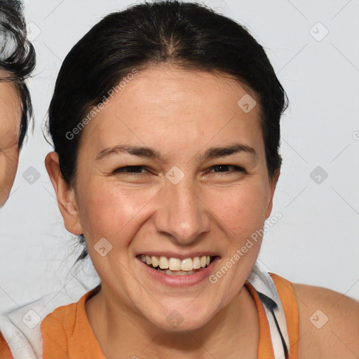 Joyful white adult female with medium  brown hair and brown eyes