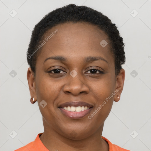 Joyful black young-adult female with short  brown hair and brown eyes