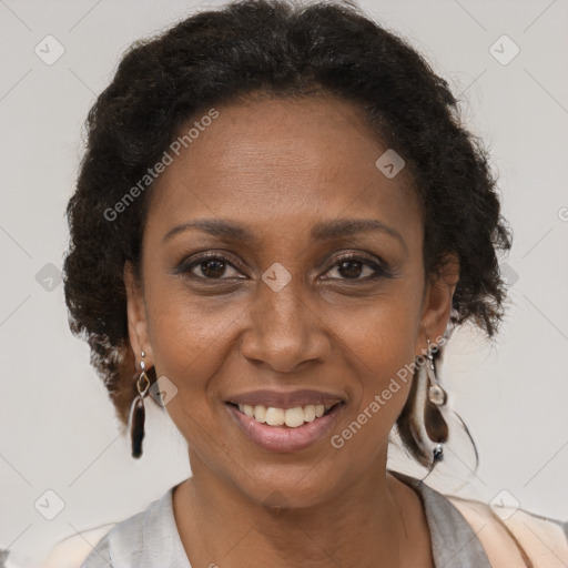 Joyful black adult female with short  brown hair and brown eyes