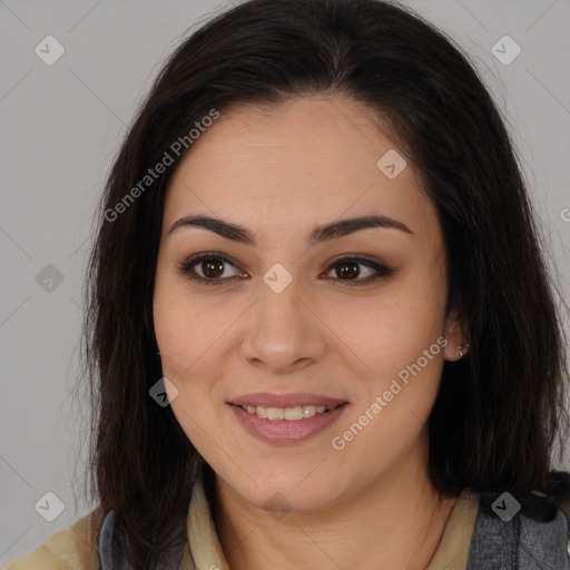 Joyful latino young-adult female with long  brown hair and brown eyes