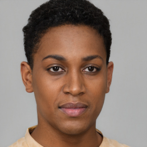 Joyful black young-adult female with short  brown hair and brown eyes