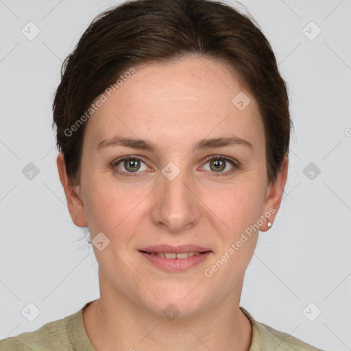 Joyful white young-adult female with short  brown hair and grey eyes