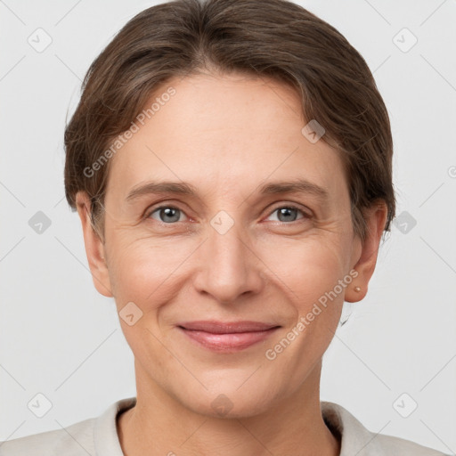 Joyful white adult female with short  brown hair and grey eyes