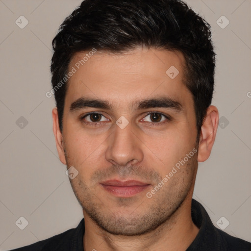 Joyful white young-adult male with short  black hair and brown eyes