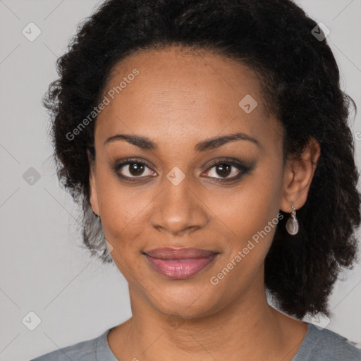 Joyful black young-adult female with medium  black hair and brown eyes