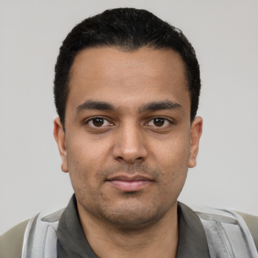 Neutral latino young-adult male with short  black hair and brown eyes