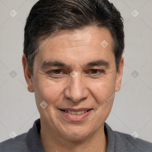 Joyful white adult male with short  brown hair and brown eyes