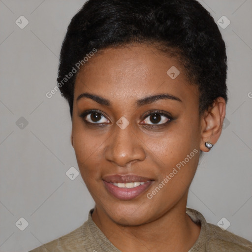 Joyful black young-adult female with short  black hair and brown eyes