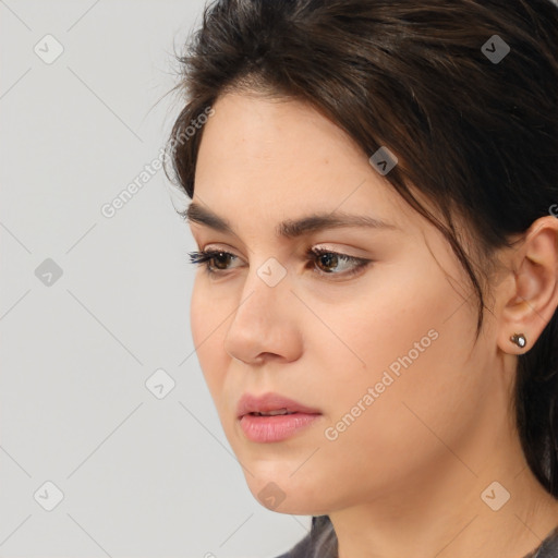 Neutral white young-adult female with medium  brown hair and brown eyes