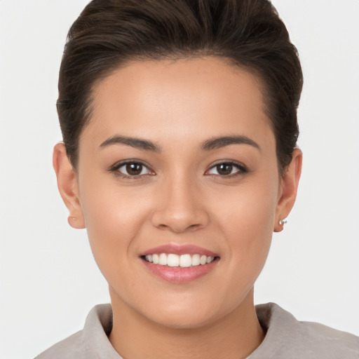 Joyful white young-adult female with short  brown hair and brown eyes