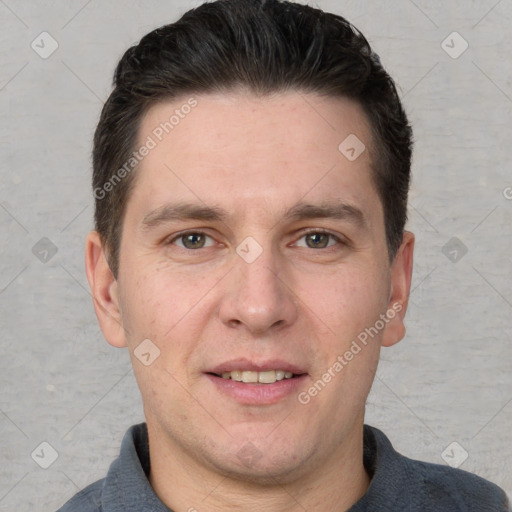 Joyful white adult male with short  brown hair and grey eyes