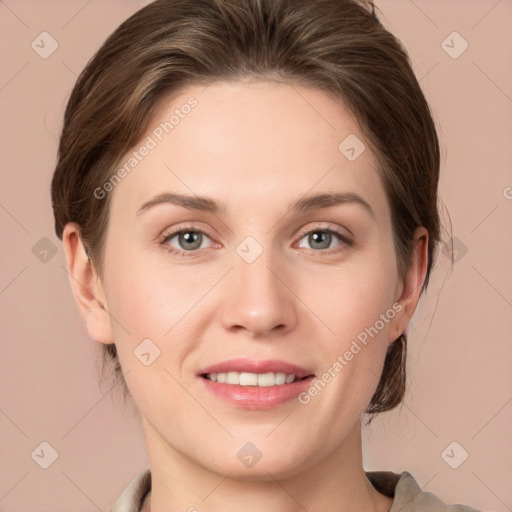 Joyful white young-adult female with medium  brown hair and grey eyes