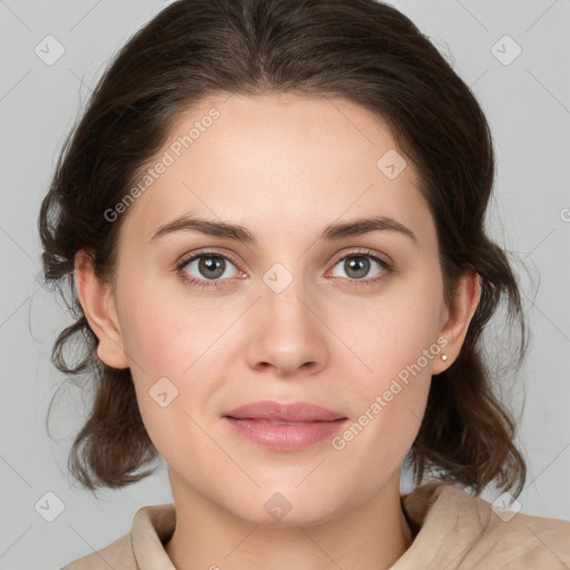 Joyful white young-adult female with medium  brown hair and green eyes