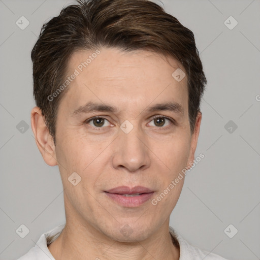 Joyful white adult male with short  brown hair and brown eyes