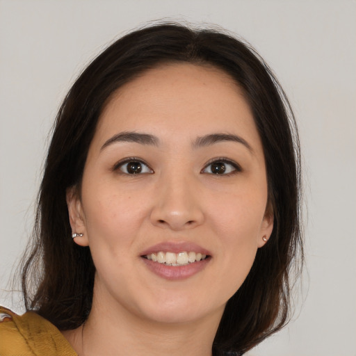 Joyful white young-adult female with medium  brown hair and brown eyes