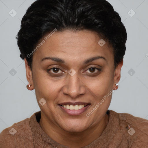 Joyful latino adult female with short  brown hair and brown eyes