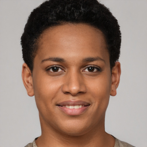 Joyful black young-adult female with short  brown hair and brown eyes