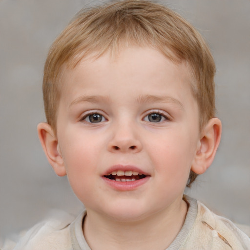 Joyful white child male with short  brown hair and blue eyes