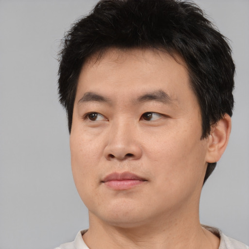 Neutral asian young-adult male with short  brown hair and brown eyes