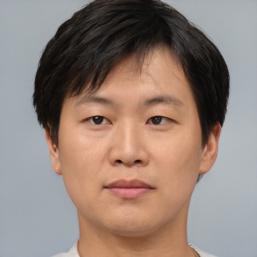 Neutral asian young-adult male with short  brown hair and brown eyes