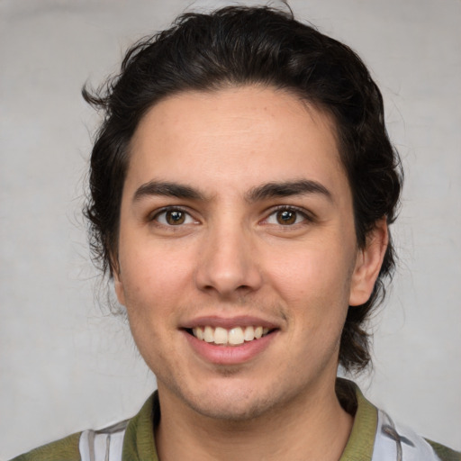 Joyful white young-adult male with medium  brown hair and brown eyes