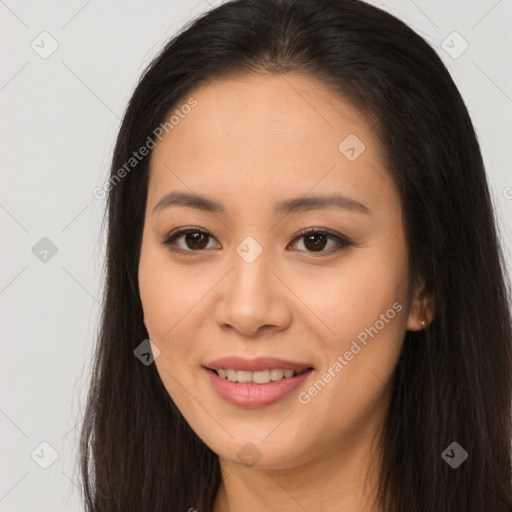 Joyful asian young-adult female with long  brown hair and brown eyes