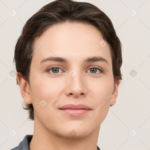 Joyful white young-adult female with short  brown hair and grey eyes