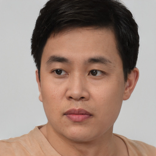Neutral white young-adult male with short  black hair and brown eyes