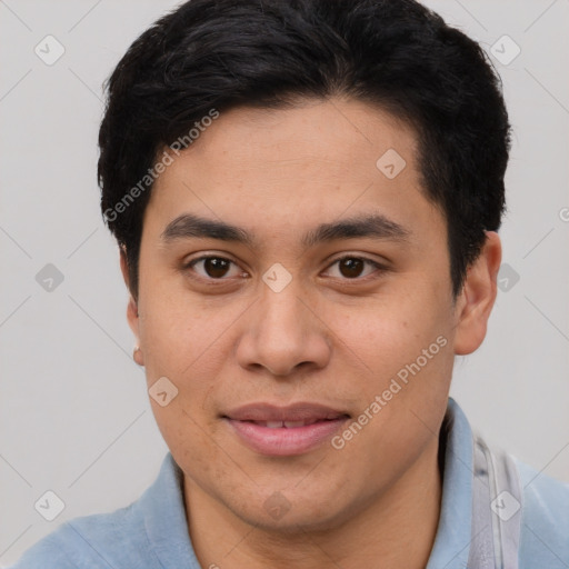 Joyful latino young-adult male with short  brown hair and brown eyes